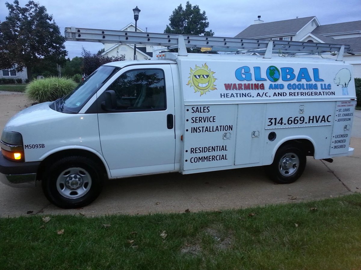 White HVAC service van with Global Warming and Cooling branding parked on residential street
